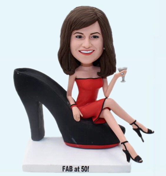 Sitting on high heels bobbleheads